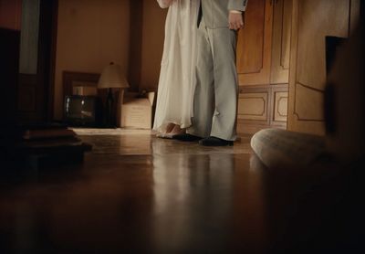 a man in a suit and tie standing in a room