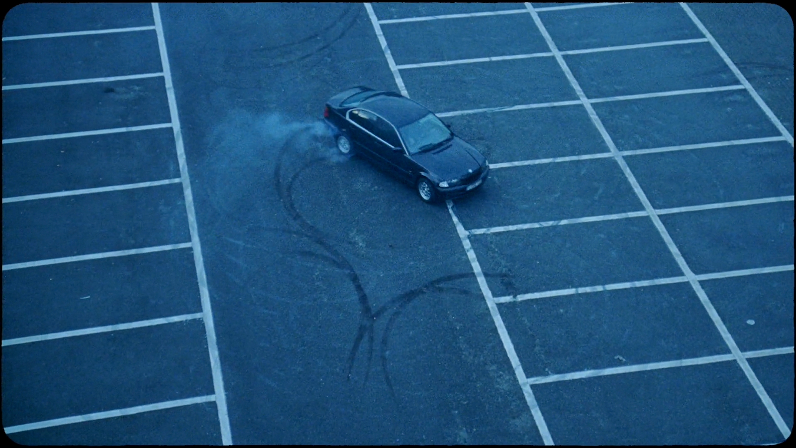 a small car is parked in a parking lot