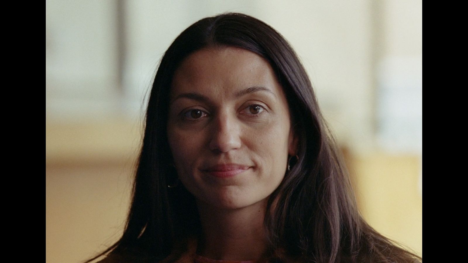 a close up of a person wearing a necklace