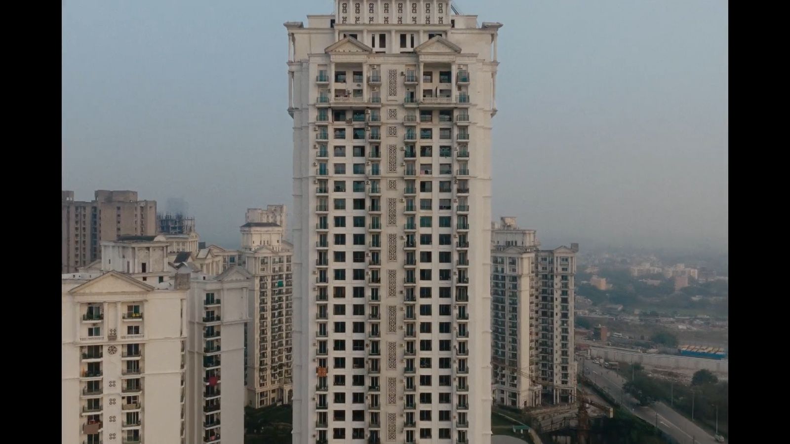 a tall building with a clock on the top of it