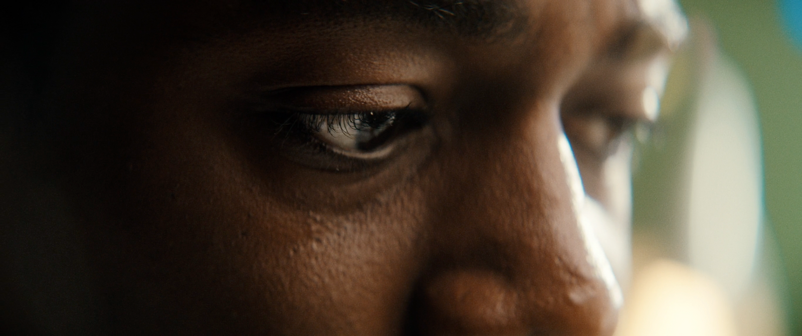 a close up of a person's eye with a blurry background