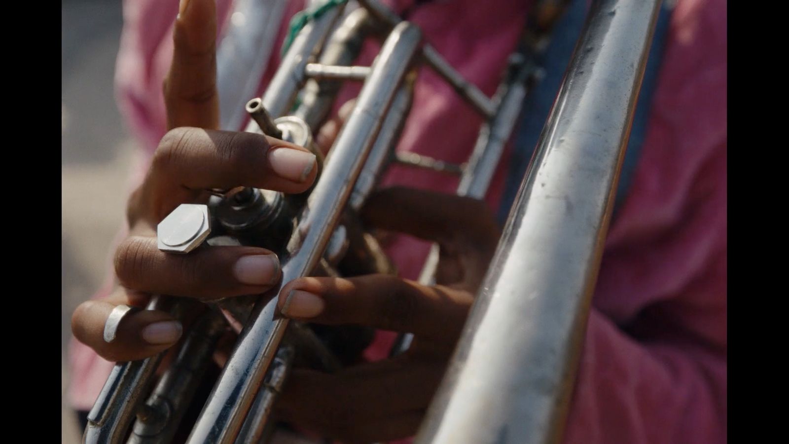 a close up of a person holding a metal object