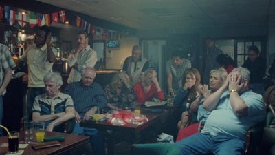 a group of people sitting around a table in a room