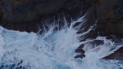 a large body of water surrounded by rocks