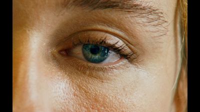 a close up of a person's blue eye