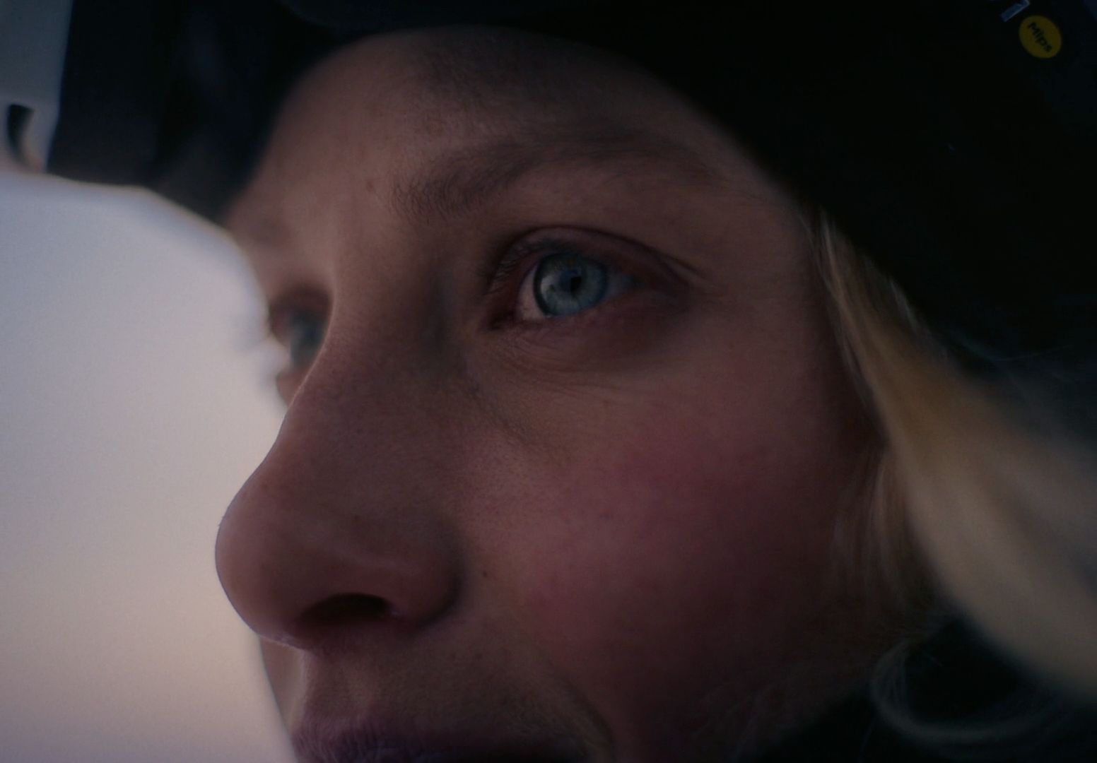 a close up of a person wearing a helmet