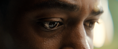 a close up of a person's eye with a blurry background