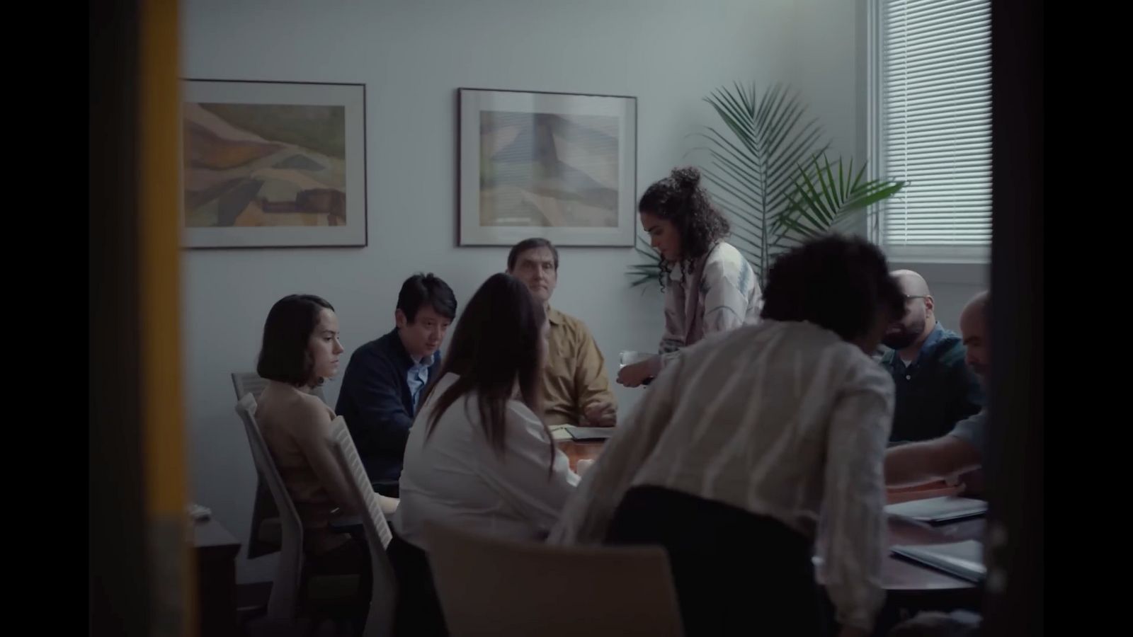 a group of people sitting around a table