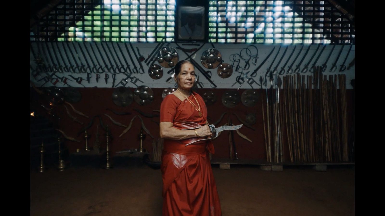 a woman in a red dress holding a piece of paper