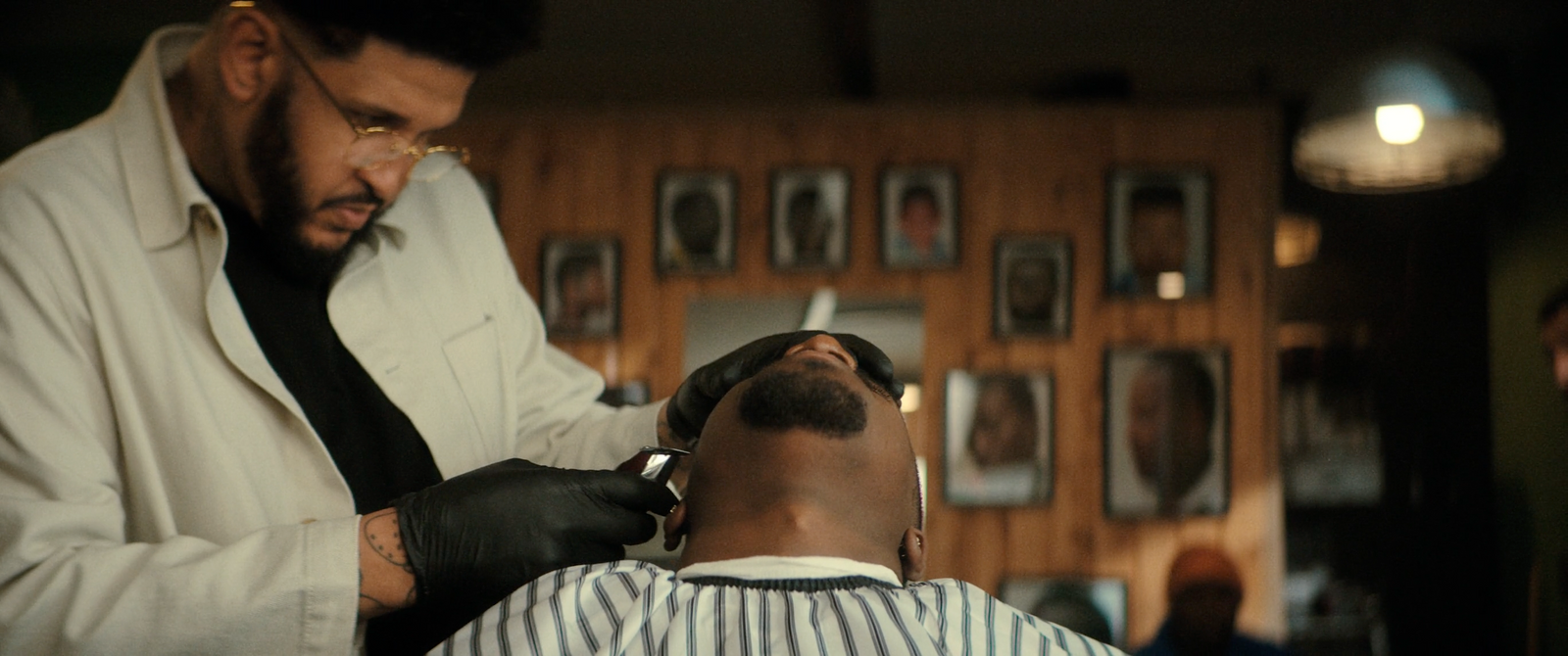 a man getting his hair cut by a barber