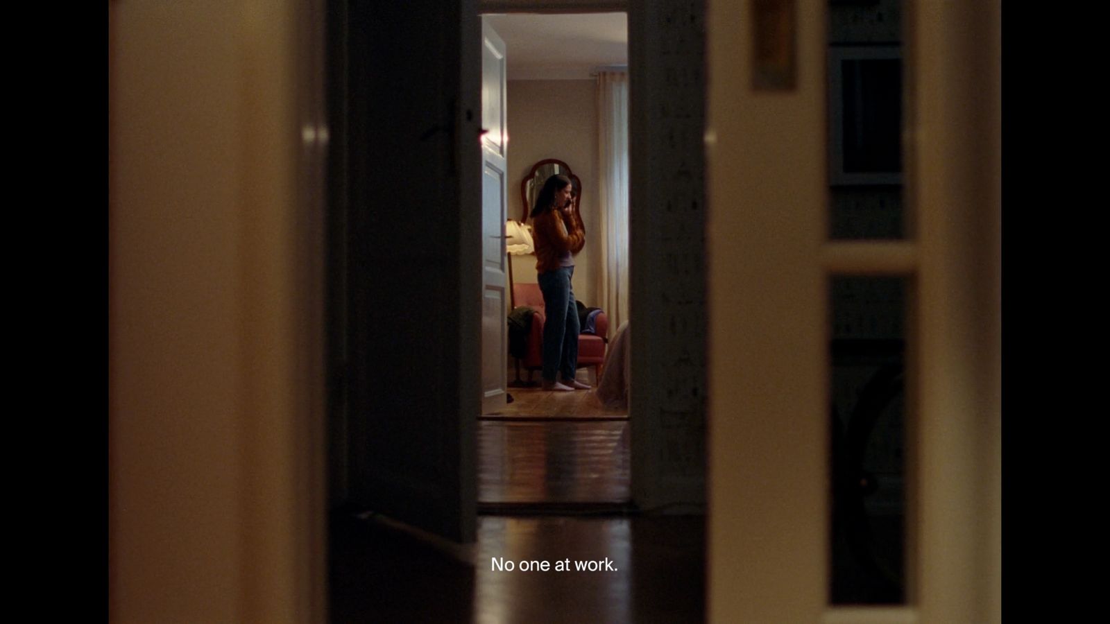 a woman standing in the doorway of a house