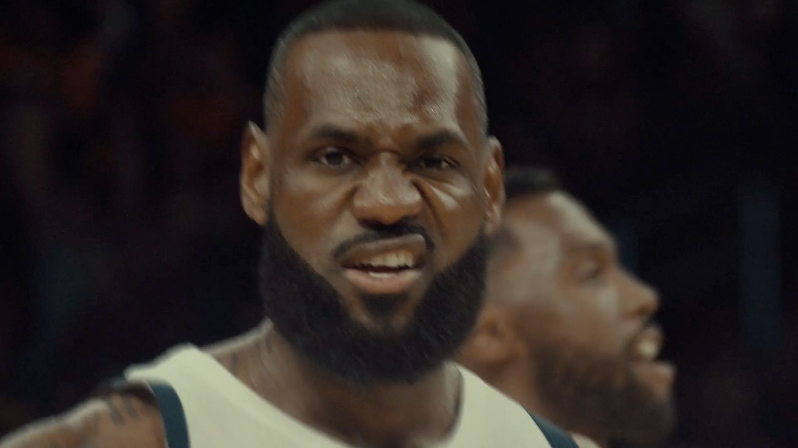 a close up of a basketball player with a beard