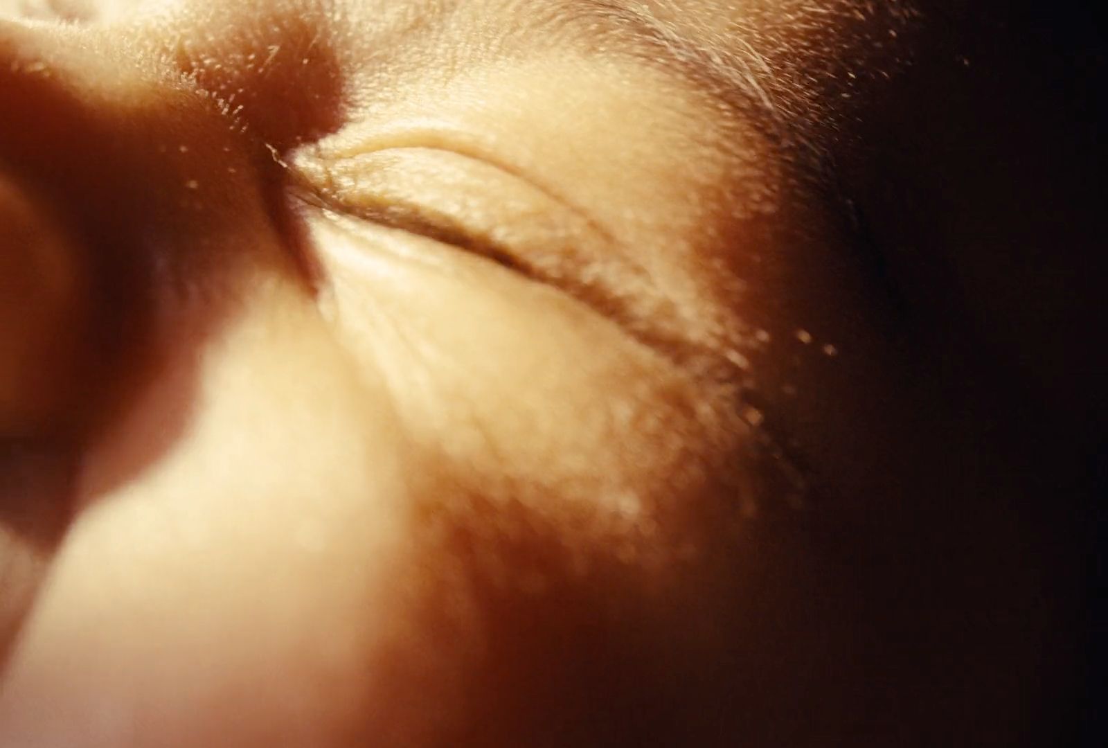 a close up of a person's face with a blurry background