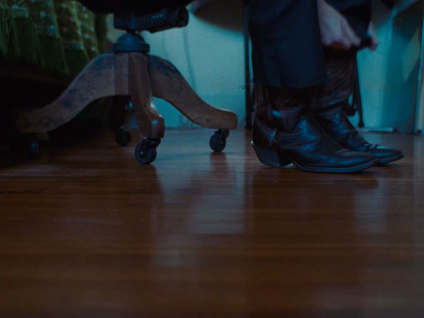 a person standing on top of a wooden floor