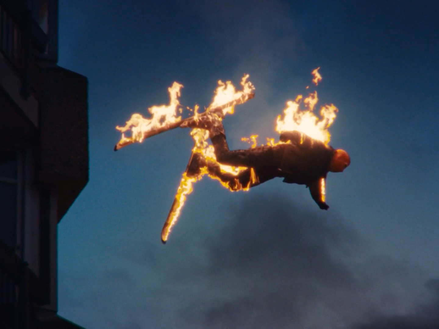 a man flying through the air while riding on top of a jet