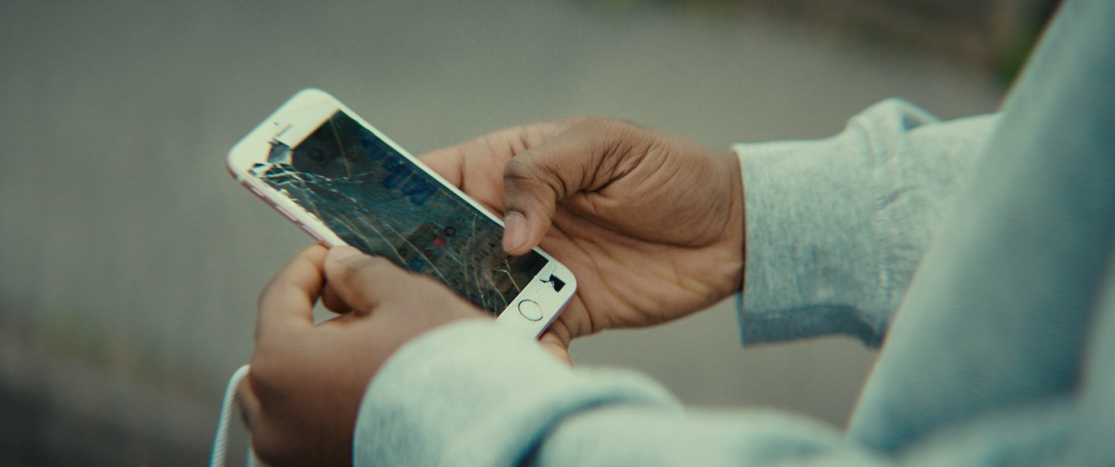 a close up of a person holding a cell phone