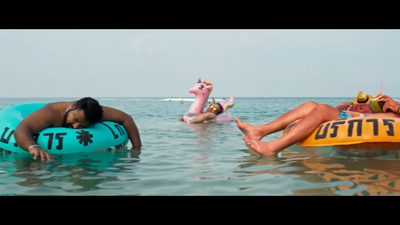 a group of people floating on inflatables in the ocean