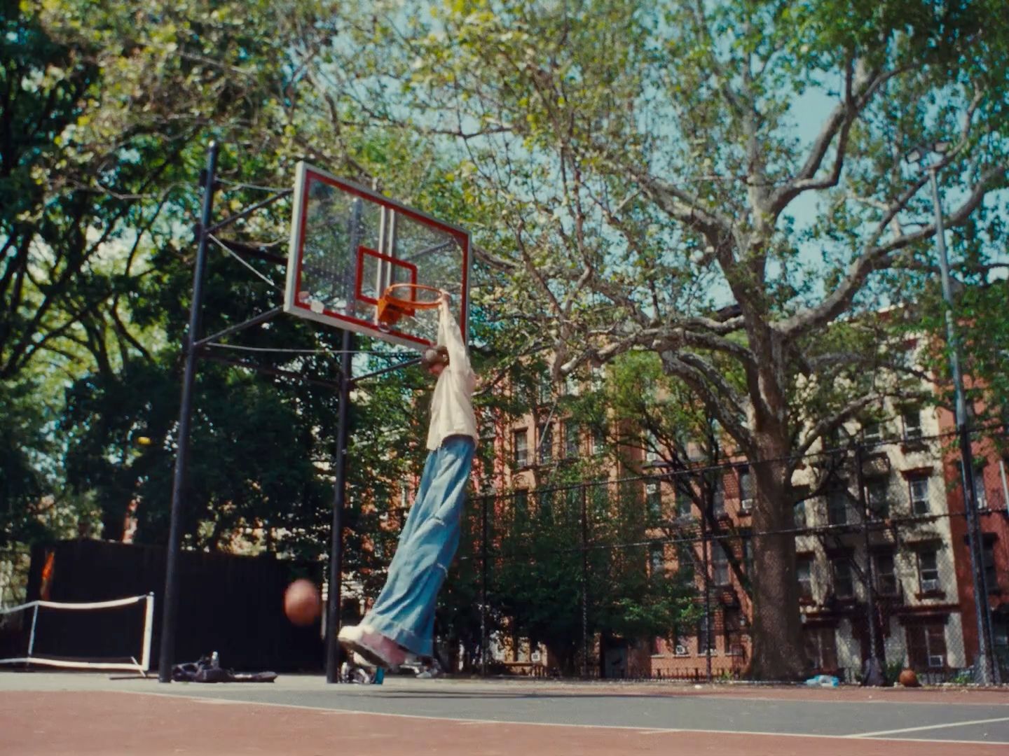 a man is playing basketball on a basketball court