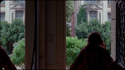 a woman standing in front of a doorway