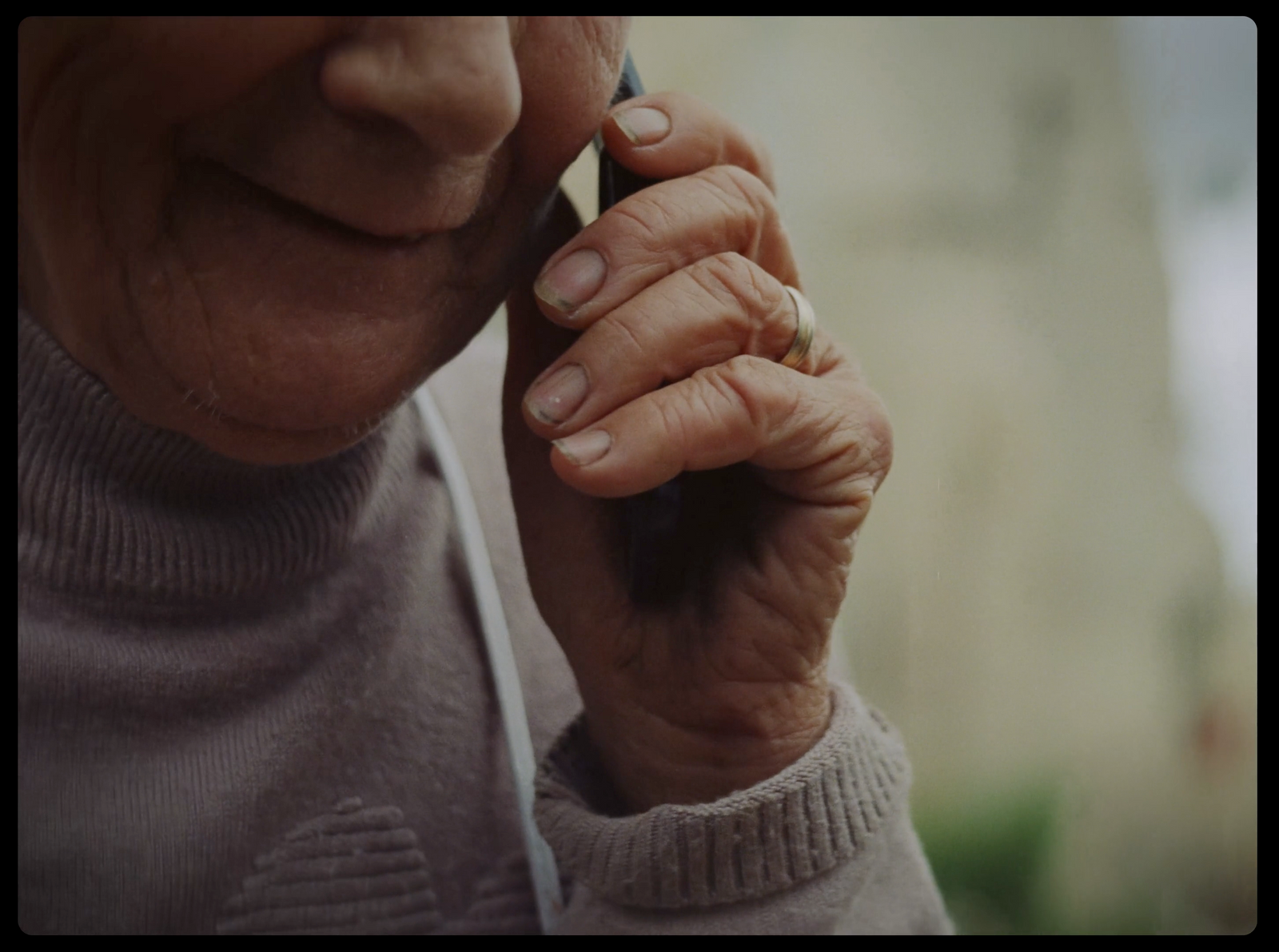 an older woman talking on a cell phone