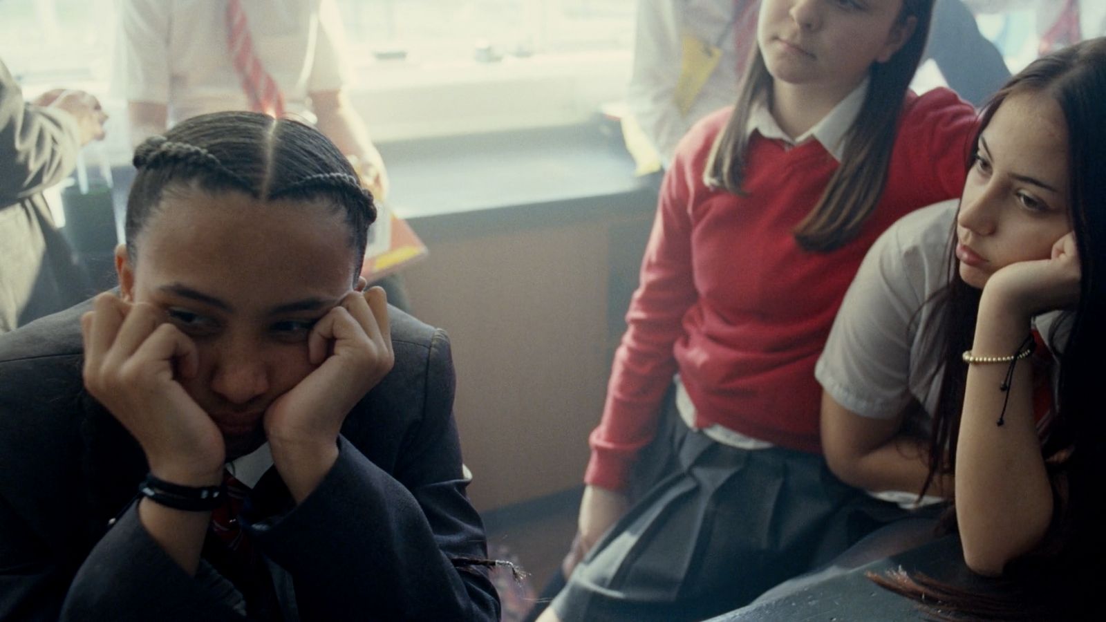 a group of young people sitting next to each other