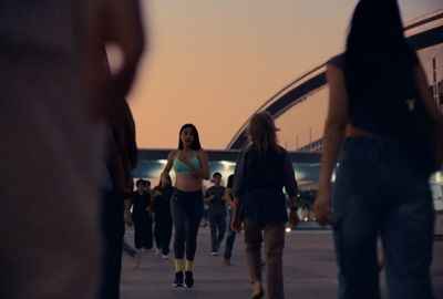 a group of people walking down a street