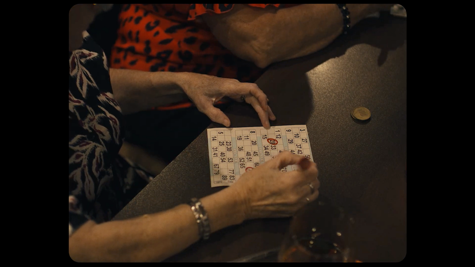 a woman is holding a box with letters on it