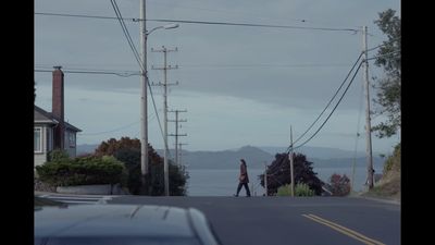 a couple of people walking down a street