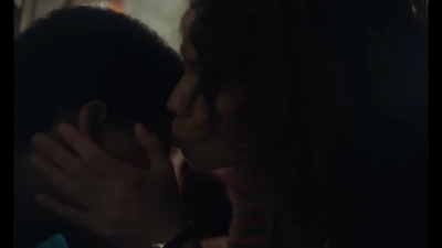 a man and a woman kissing each other