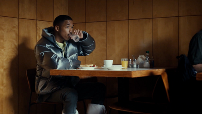 a man sitting at a table eating food