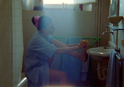 a woman sitting on a toilet in a bathroom