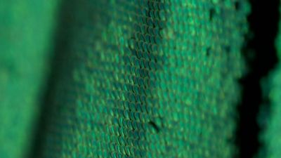 a close up view of a green fabric