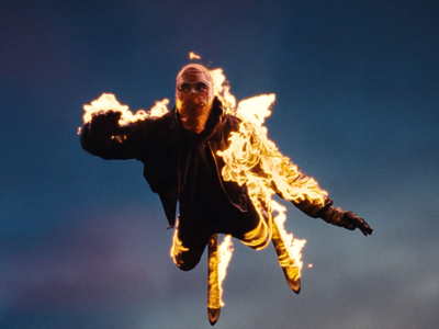 a man flying through the air while riding a skateboard