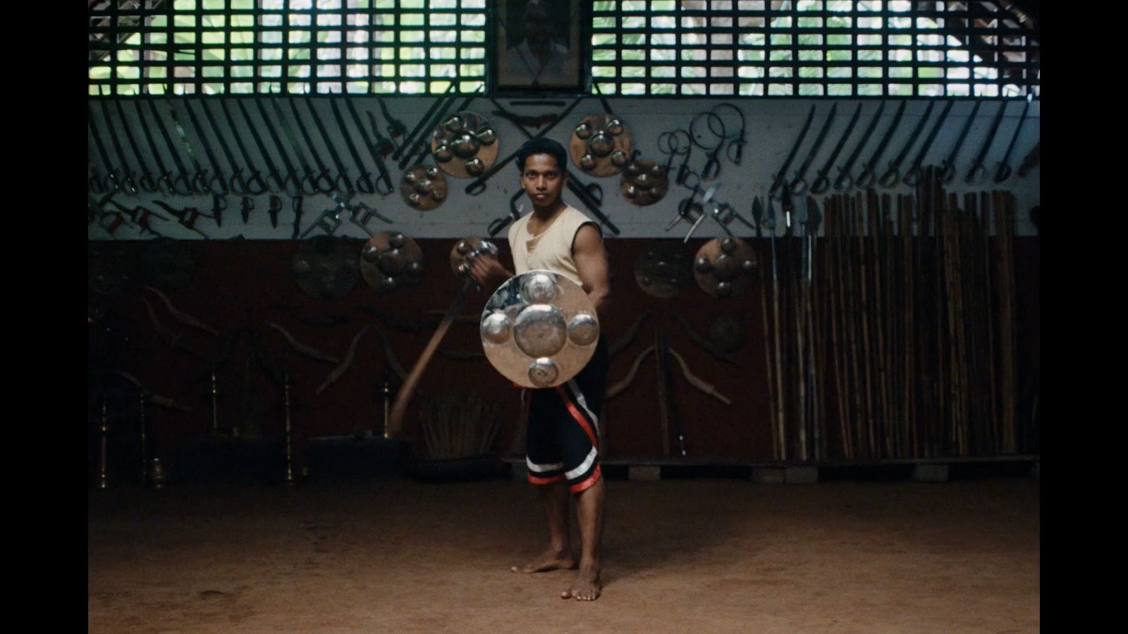 a man holding a silver object in his hands