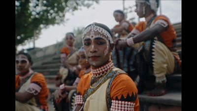 a group of people dressed in indian garb