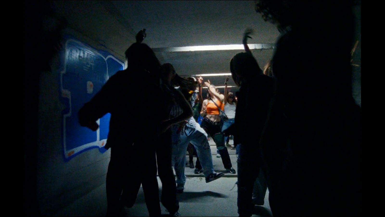 a group of people standing in a tunnel