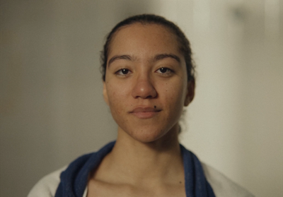 a woman with a blue scarf around her neck