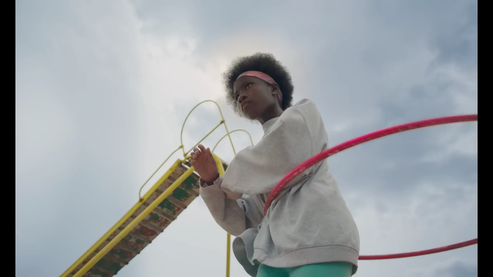 a young girl is playing with a toy