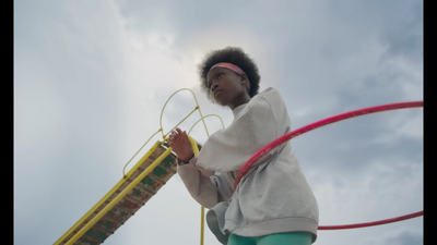 a young girl is playing with a toy