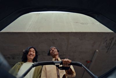 a couple of people standing next to each other