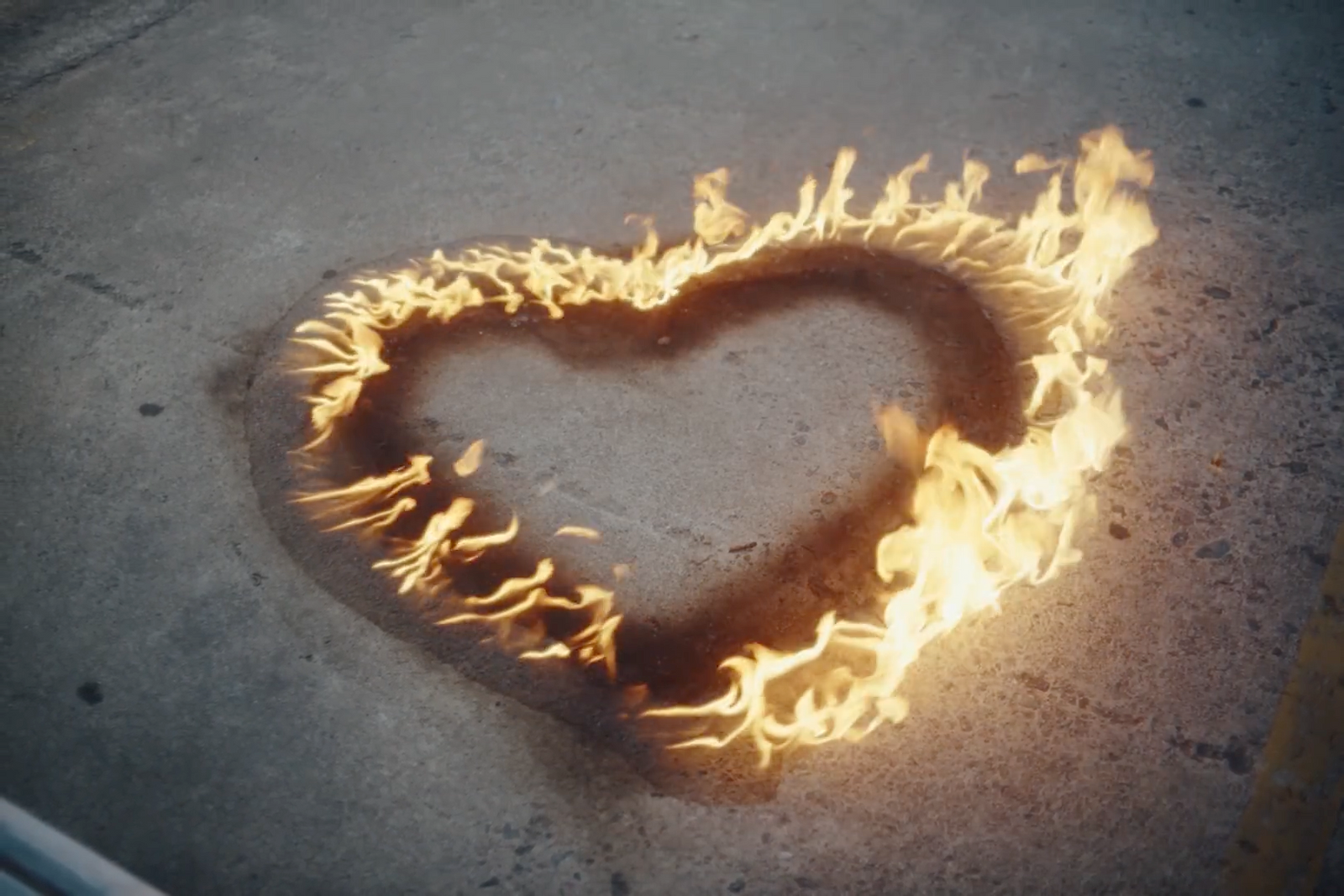 a heart made of fire on the ground