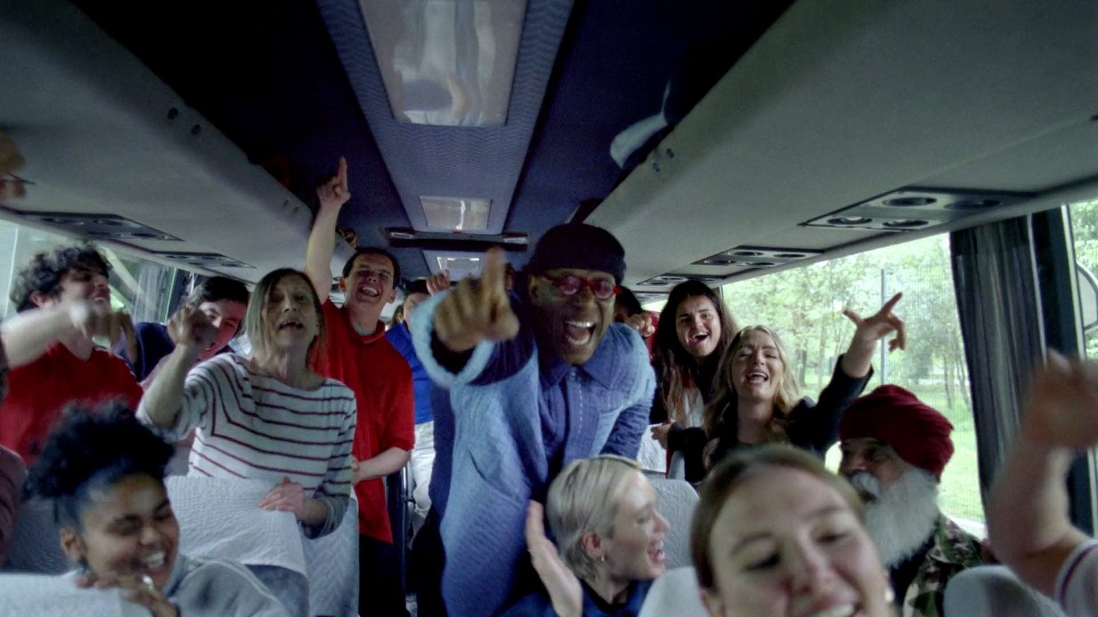 a group of people riding on the back of a bus