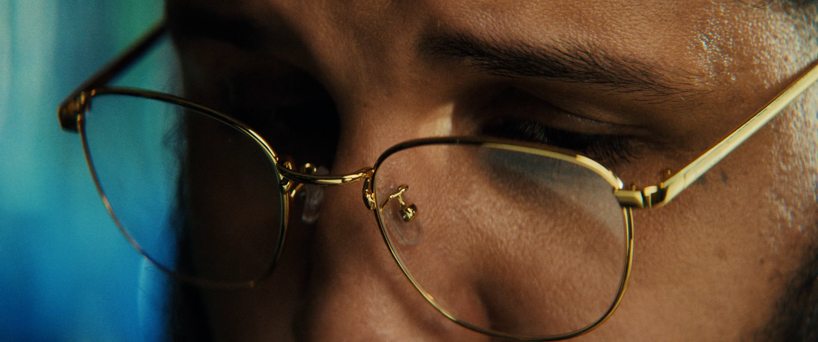 a close up of a person wearing glasses