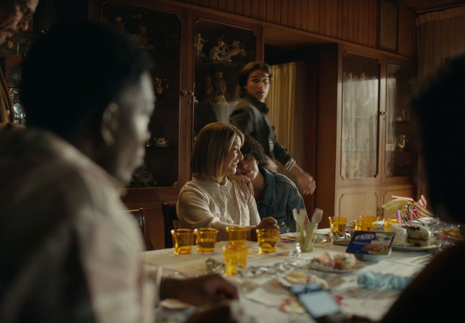 a group of people sitting around a dinner table