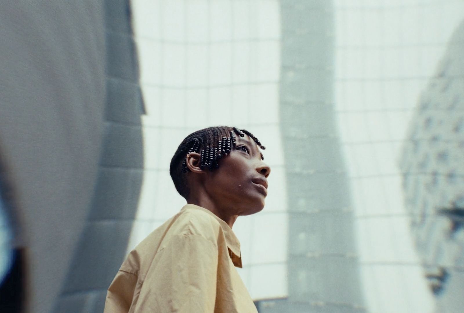 a woman standing in front of a building