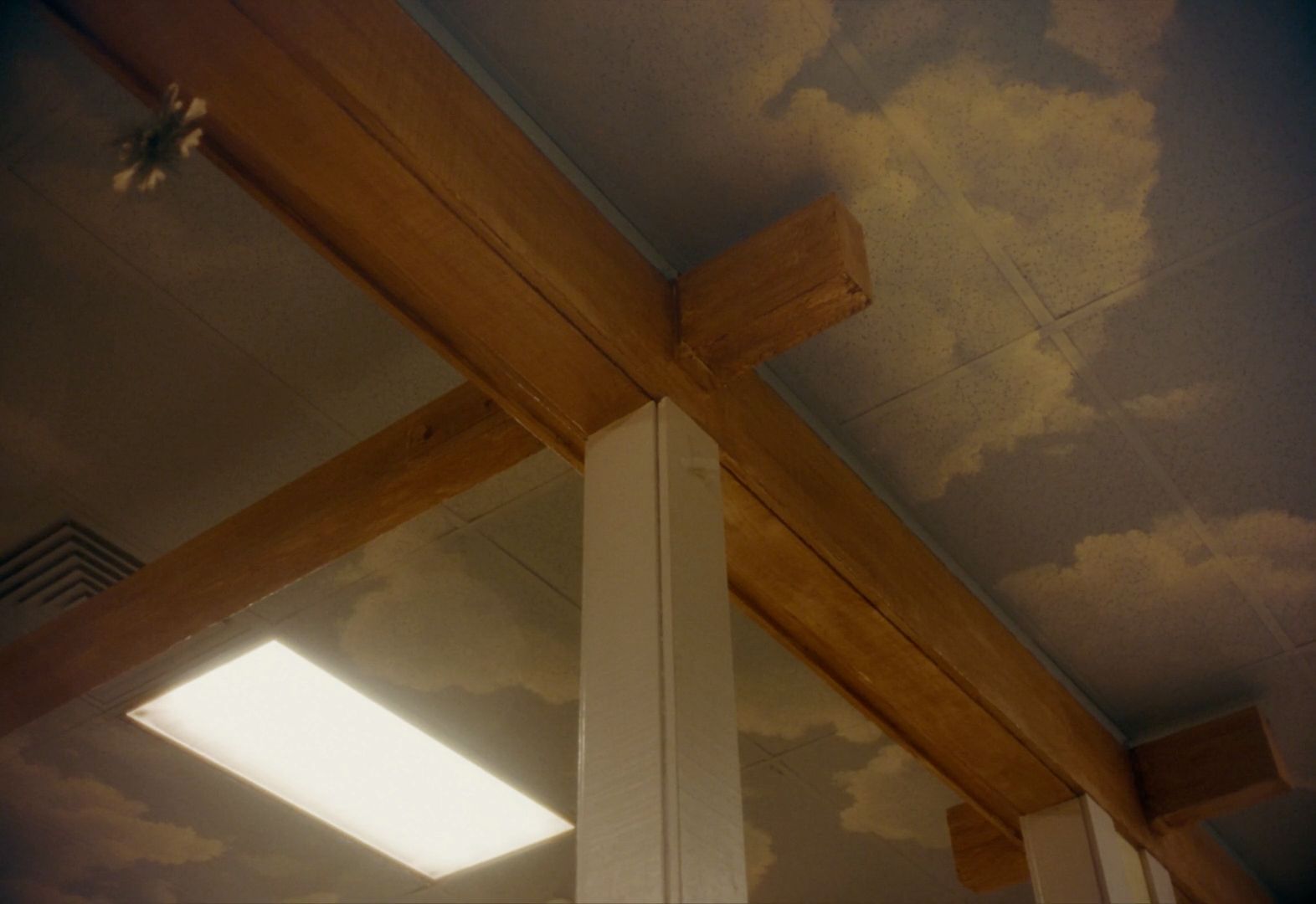 the ceiling of a room with a sky painted on it