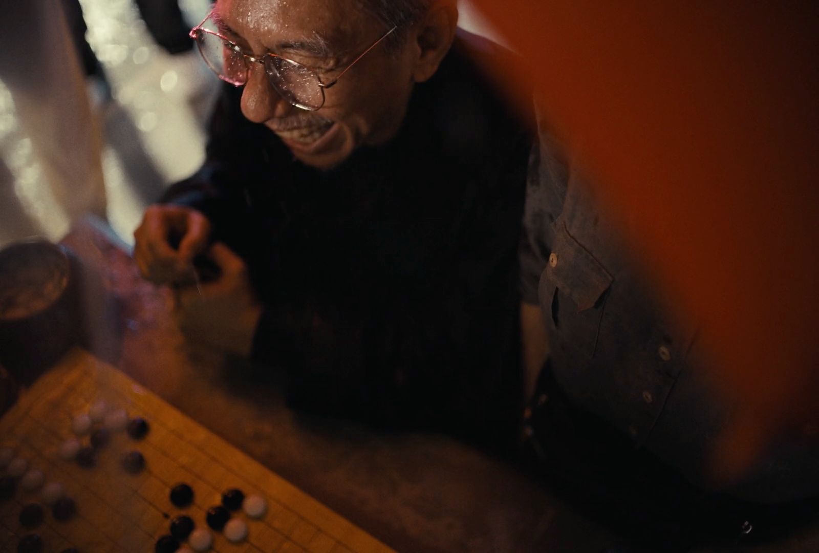 an older man playing a game of go