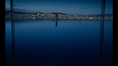 a person riding a surfboard on a body of water