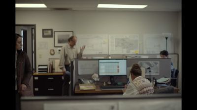 a group of people working in an office