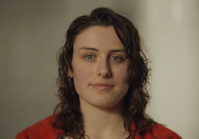 a close up of a person wearing a necklace